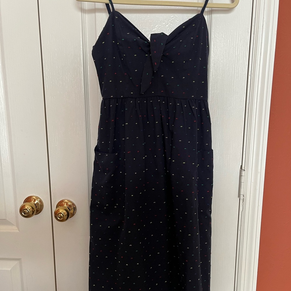 Navy midi dress, pops of color, flattering neckline, tie-up bustier top, pockets